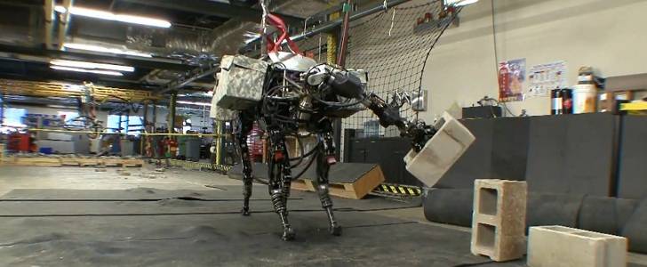 BigDog tosses cinder blocks across the room like a robotic boss