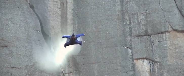 Alexander Polli flies his wingsuit through a tiny hole at 155 MPH