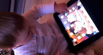 For this one-year-old, a magazine is simply a broken iPad
