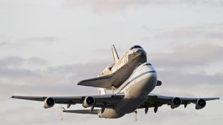 Space Shuttle Discover travels to its final resting place in style