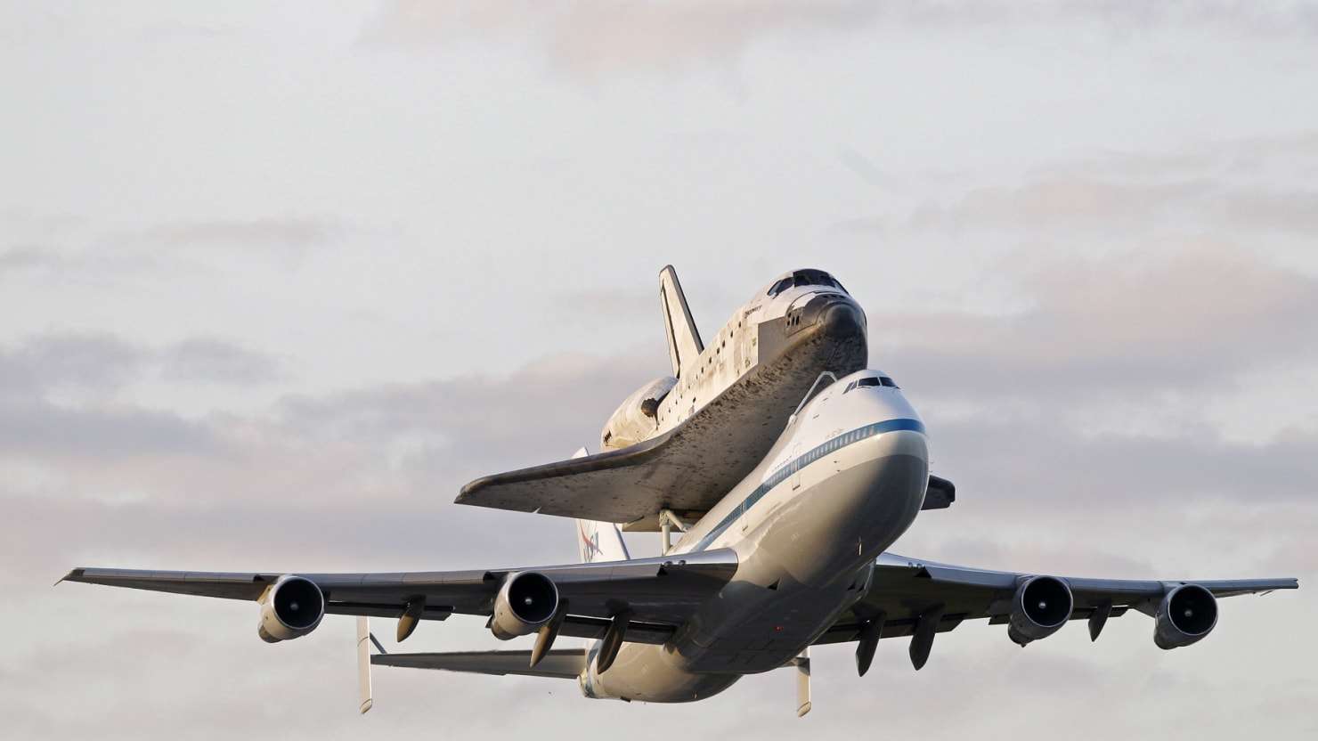 Space Shuttle Discovery travels to its final resting place in style