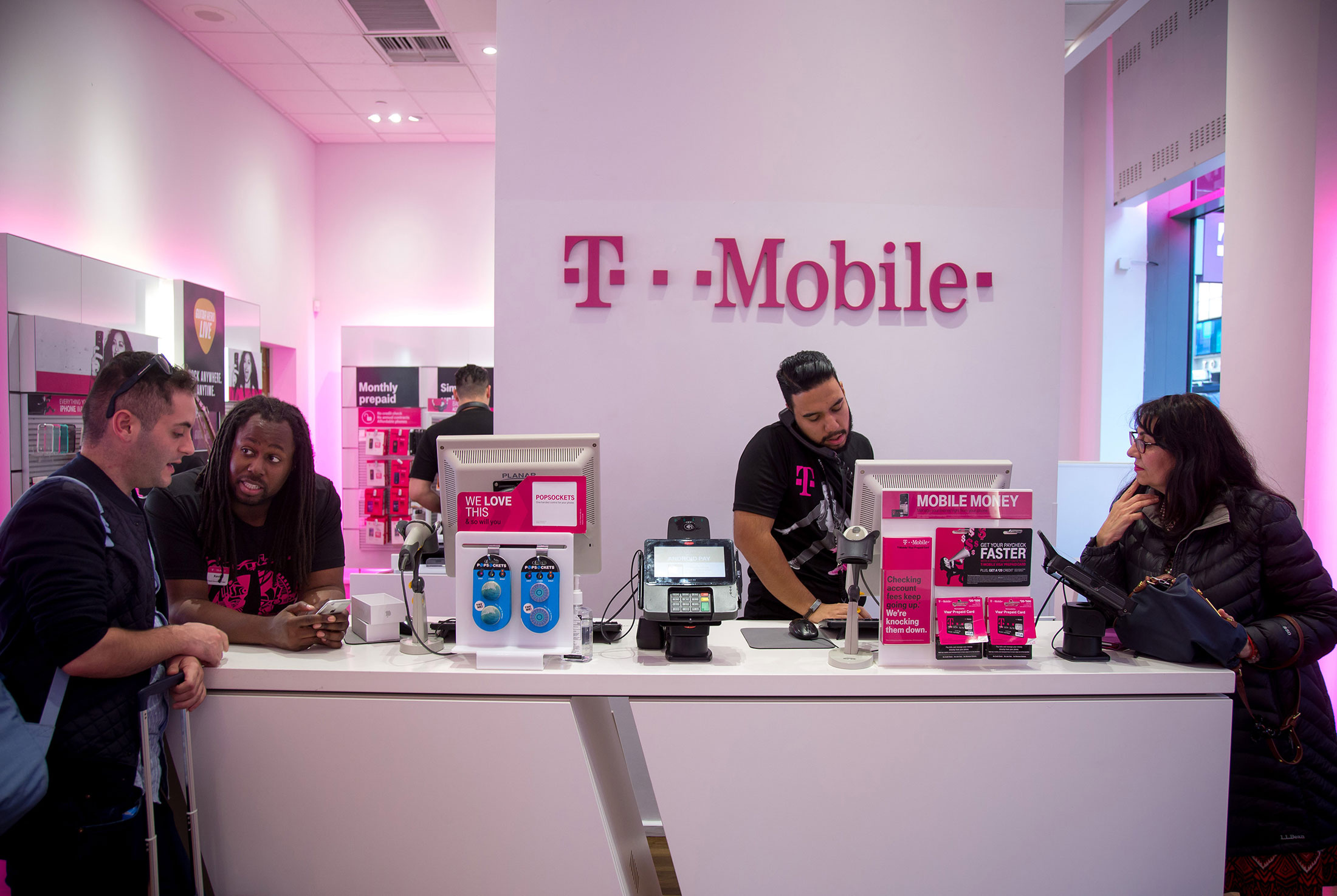 Lines at T-Mobile stores show Apple's clout