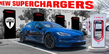 Tesla V4 Supercharger station with a blue Tesla Model S parked and charging in front of new charging stalls.
