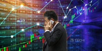 Investor on phone in front of rising stock market graphs and trading data, reflecting global stock rally on US-China trade optimism