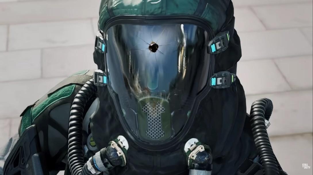 Close-up of a soldier in a futuristic tactical suit with a cracked visor, showcasing advanced gear and high-tech equipment in Call of Duty: Black Ops 7.