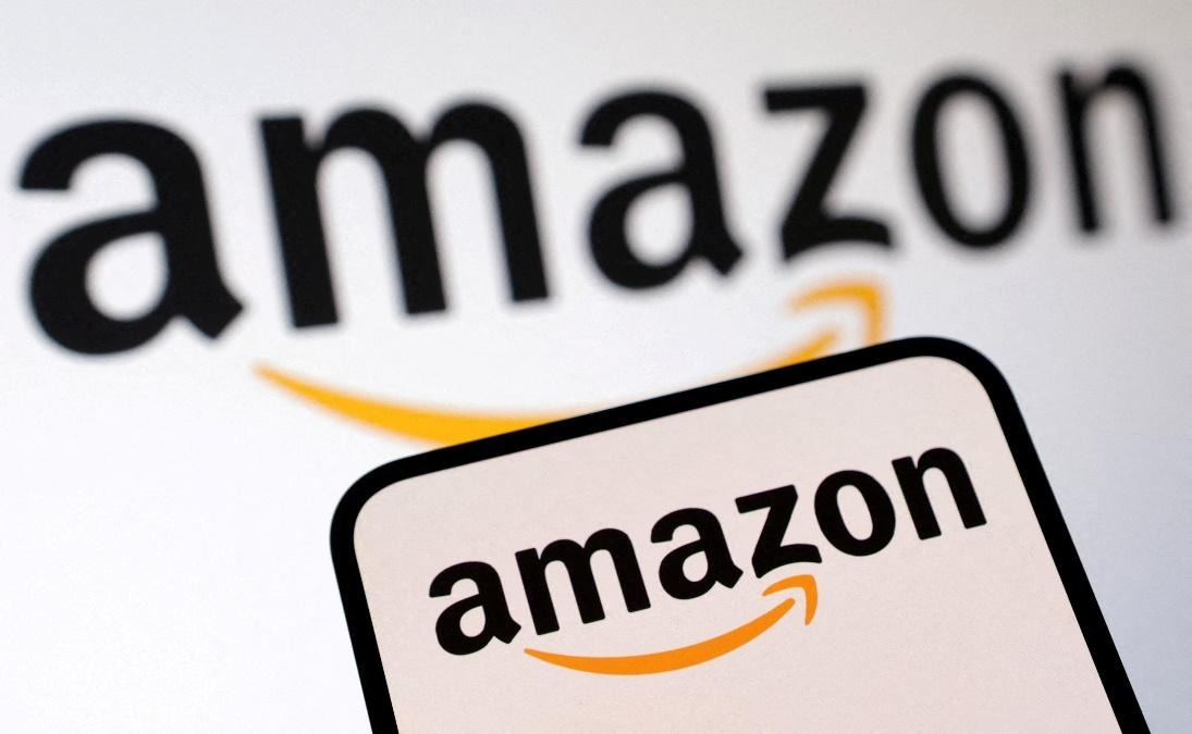 Amazon logo close-up with a clear view of the iconic smile and font, featuring both the full logo and a smaller version of the logo on a card.