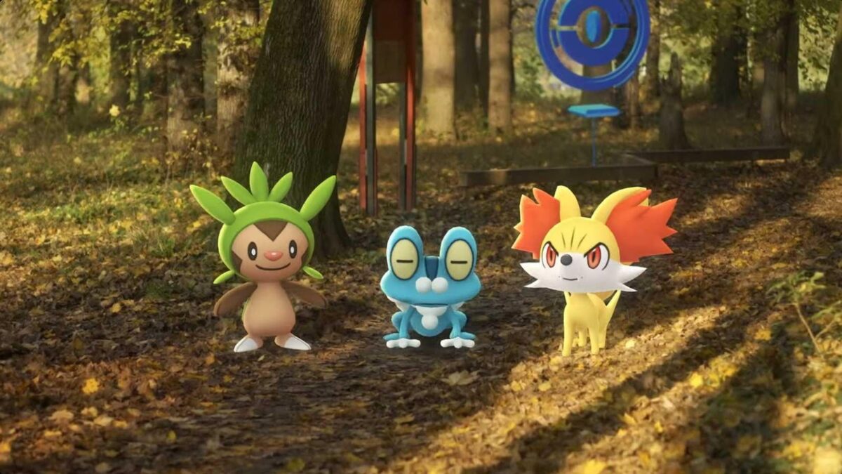 Pokémon Go to Add Long-Awaited Remote Trading Feature 1 Chespin, Froakie, and Fennekin on a forest path with PokéStop in background, TECHi branding.