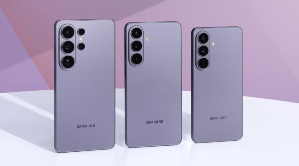 Three lavender Samsung smartphones with varying camera setups displayed against a purple geometric background